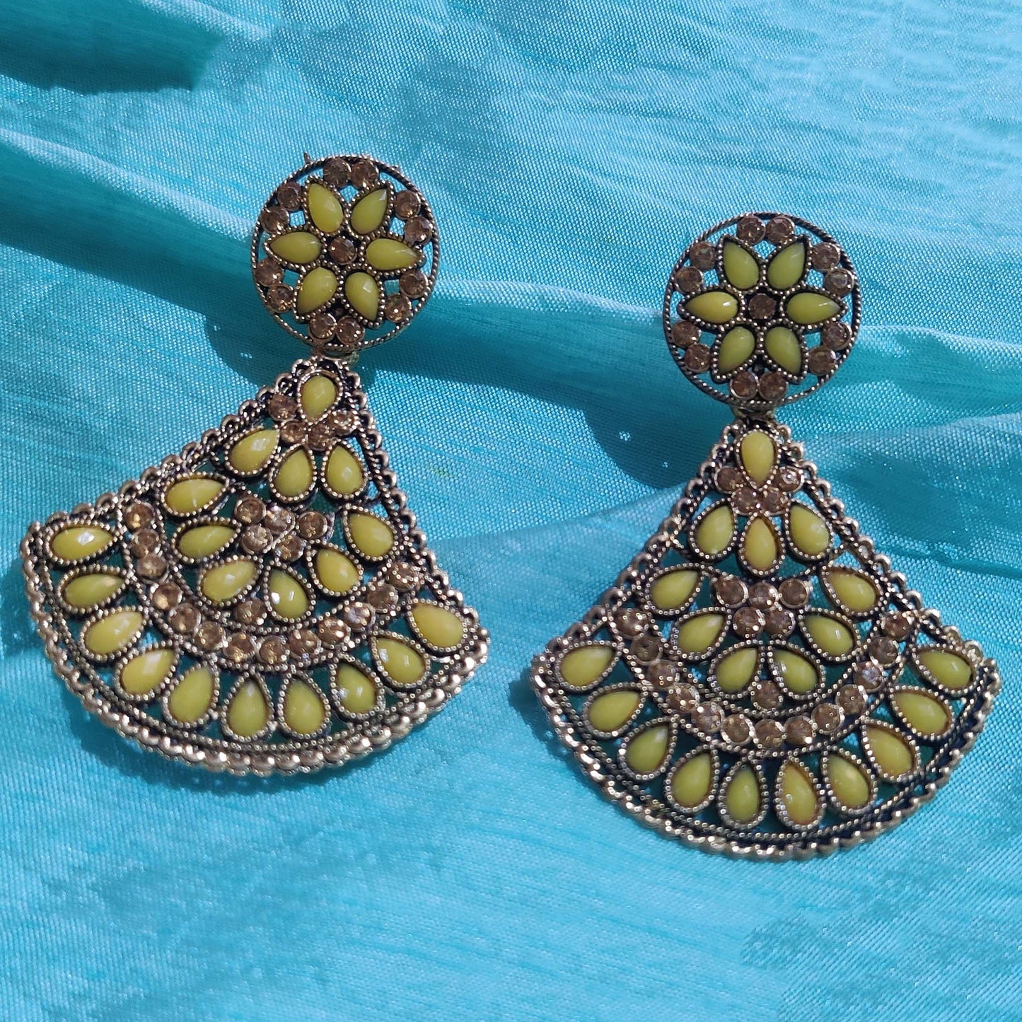 Vastradi Alloy Crystal Fan Stone Work Earring in Yellow Colour